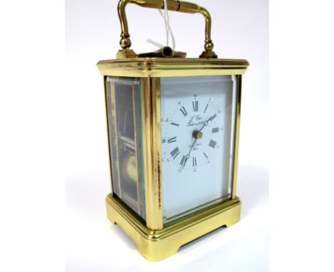 A Modern French Carriage Clock, the petite sonnerie movement striking on a coiled gong, the white enamel dial with Roman and 