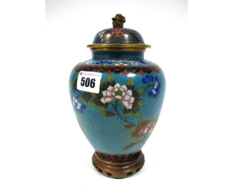 An Early XX Century Japanese Cloisonné Enamel Vase and Cover, with dog of fo finial, the ovoid blue ground decorated with flo