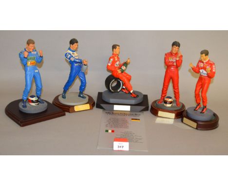 Five unboxed resin Racing Driver figurines including Jean Alesi and Michael Schumacher, standing figures approximately 19cm t