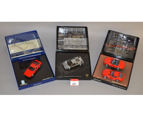 Minichamps. Two diecast models in 1:43 scale, Lamborghini Countach LP400 1974 and a De Tomaso Mangusta 1969 together with a D