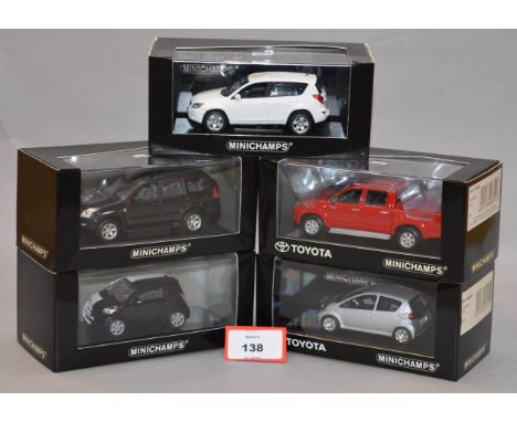 Minichamps. Five Toyota diecast model cars in 1:43 scale, including Hilux, Aygo, RAV4, Land Cruiser and IQ variants. All of t
