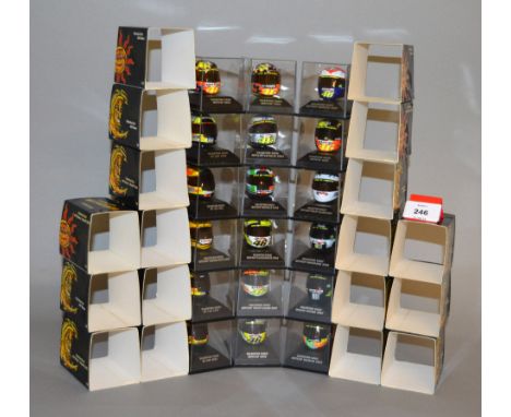 Minichamps. Eighteen Valentino Rossi diecast Helmets in 1:8 scale, MotoGP Valencia 2003 and MotoGP Mugello 2002 together with