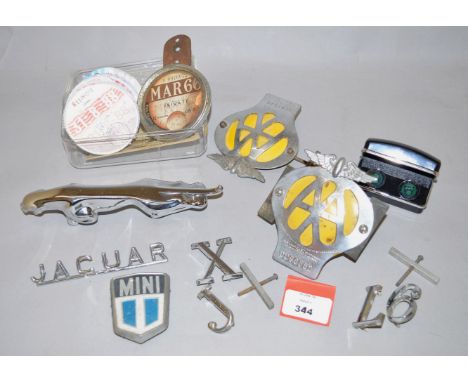 A small quantity of vintage car badges including two 'AA'  badges, various Jaguar badges, a chrome Jaguar bonnet mascot, 'Jag