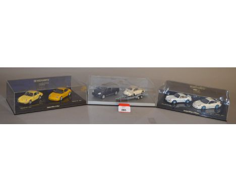 Minichamps. Three Porsche model sets, each containing two diecast models in 1:43 scale including a Porsche 911 Anniversary Se