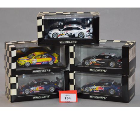 Minichamps. Five Audi A4 DTM diecast model cars in 1:43 scale together with an Audi Quatro. Four of the models are limited ed