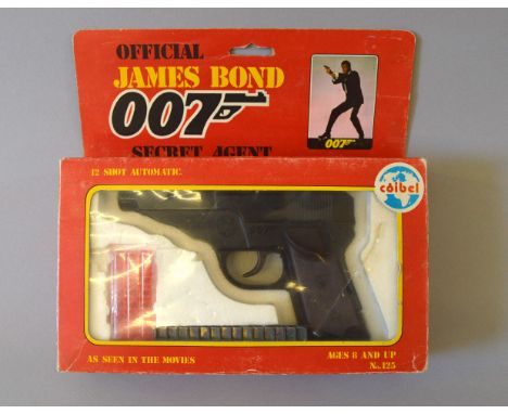 The Yeovil Collection, James Bond 007. Three Coibel (Spain) Official James Bond items: Secret Agent 12 Shot Automatic Pistol,