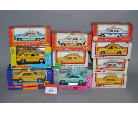 Ten boxed diecast Taxi models, mostly in 1:43 scale, including seven from the Tomica Dandy range, Nissan Cedric and  Toyota C