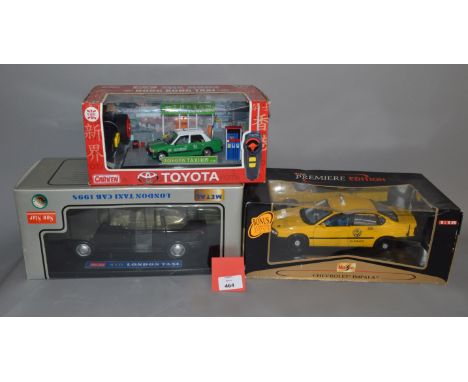 Three boxed diecast Taxi models, a 1:38 scale Carven R/C Toyota Hong Kong Taxi, a Sun Star 1998 London Taxi and a Maisto Chev