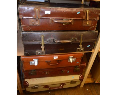 Five vintage suitcases, well used.