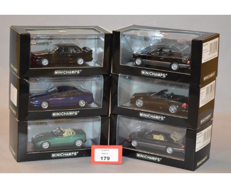 Minichamps. Three Mercedes Benz diecast model cars in 1:43 scale including an SL63 AMG and 300 CE-24 Coupe and Cabriolet vari