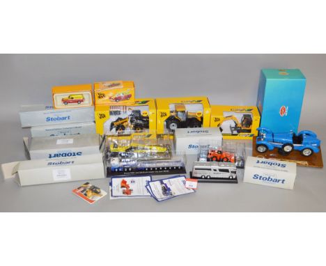 A mixed group of boxed diecast models in a variety of different scales including three Britains JCB models in 1:32 scale, a B