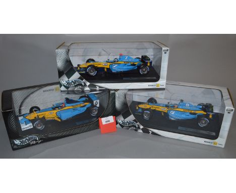 Three Hot Wheels Racing 1:18 scale diecast models: Renault F1 Team R24 Jarno Trulli; Renault F1 Team R24 Fernando Alonso; Ren