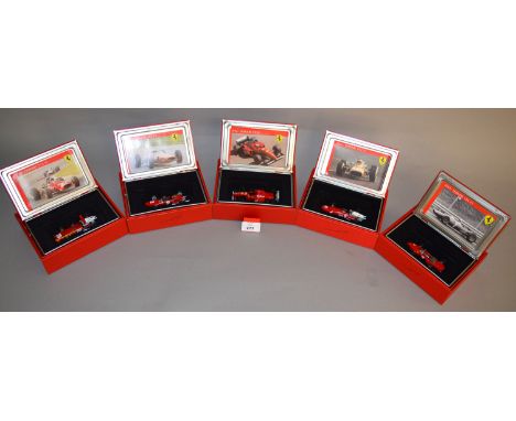 Five Hot Wheels diecast Ferrari models in 1:43 scale including a 1963 156, a 1964 158, a 1966 F310, together with 1967 and 19