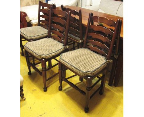 COUNTRY LADDER BACK CHAIRS, a set of six, Georgian style beechwood with rush seats and cushions, each 46cm W x 39cm D x 95cm 