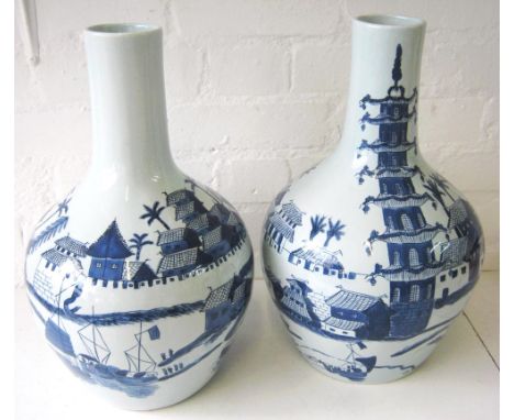 ALTFIELD VASES, a pair, Oriental style blue and white ceramic decorated landscapes with figures, buildings and boats, each 41