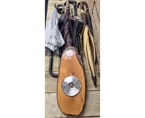 A Selection of umbrellas, parasols and walking stick. The lot also comes with a wall barometer.