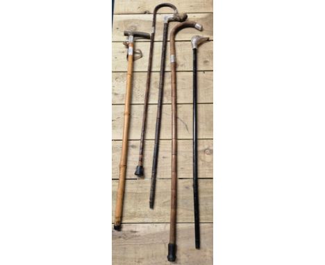 A Collection of Antique &amp; Silver mounted Walking sticks; Novelty metal Duck topped walking stick, &amp; Silver mounted wa
