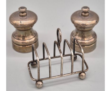 Sheffield silver four slice toast rack produced by Harrison Brothers &amp; Howson. Together with Two Birmingham silver pepper