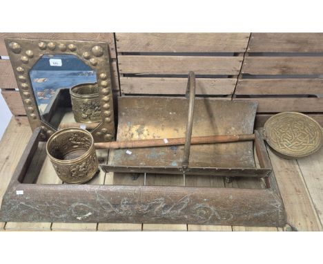 A Selection of brass wares; Arts and crafts worked fire fender, Brass log holder, Arts and crafts worked ped pan, Arts and cr