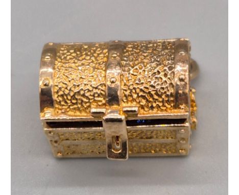 9ct yellow gold treasure trunk charm pendant. Fitted with various glass stones. [5.79grams] 