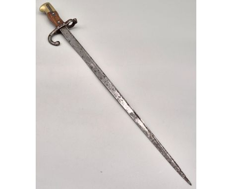1881 French Bayonet. Showing various markings and engraved to the side of the blade. Brass and wood handle, push button works