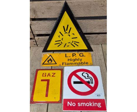 A Selection of Hazard enamel and metal signs. Metal and enamel No Smoking sign, L.P.G. Highly Flammable sign and two others.