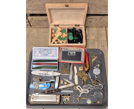 Tray of collectables; Wooden Chess set, Clock keys, Harmonica, Sealing Wax, Eye loop with fitted compass, Fruit knives and ma