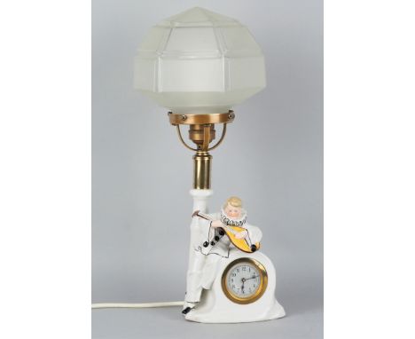 Art Déco Lampe mit Uhr um 1920Außergewöhnliche Tischlampe mit integrierter Uhr, Lampenfuß aus Porzellan, ovaler Stand, darauf