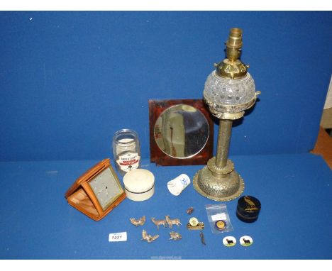 A quantity of miscellanea to include a metal lamp base and cut glass orb (converted to electric), Rotherham travel alarm cloc