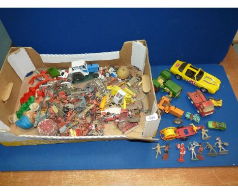 A number of miscellaneous vintage toys to include: cars, tractors, lorries, a puppet and a number of toy soldiers, etc.