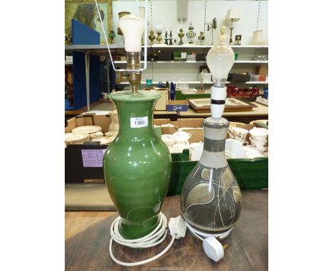 Two pottery lamp bases, one with green glaze and the other with foliage detail.