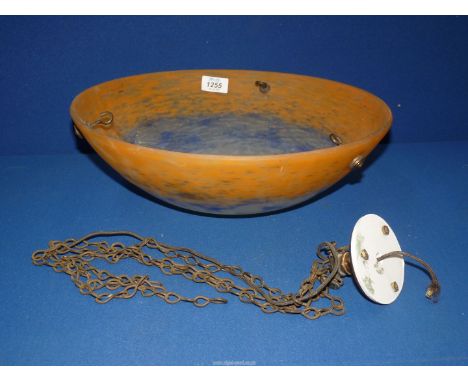 An orange and blue glass hanging ceiling light shade and chains, 14" diameter.