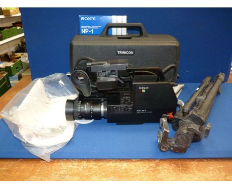A Sony HVC-4000D Trinicon Video Camera, lens Sonoptor f 1.4 11-70mm, cased, complete with manual, plus large camera tripod.