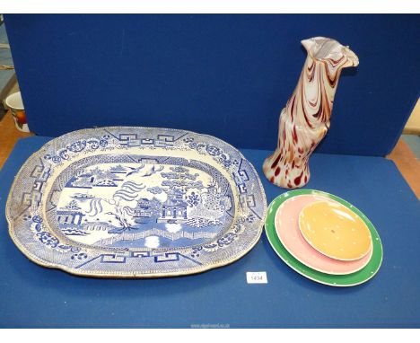 A willow pattern blue and white meat plate, Royal Winton cake stand, and a mottled white on red glass vase.