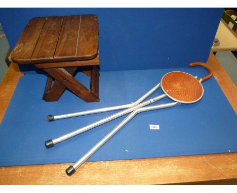 A tripod Walking stick seat and a folding wooden footstool.