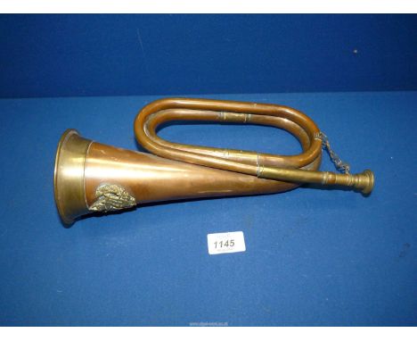 A copper and brass bugle.