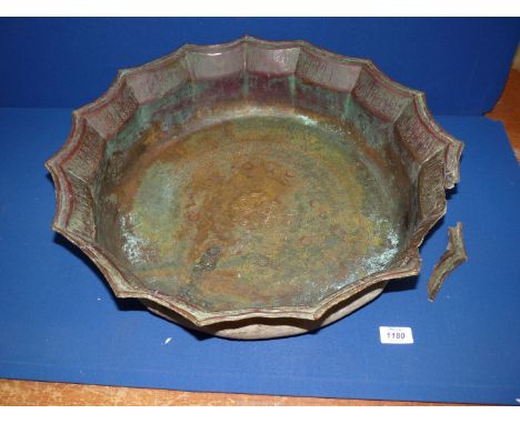A large Khorassan bronze basin requiring restoration, circa 12th c AD, with cusped rim and silver inlays, extensively engrave