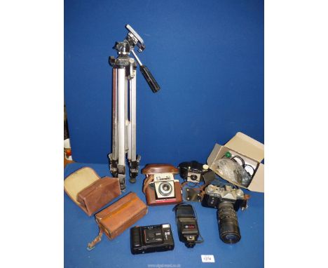A quantity of photographic items including Zenit E 35mm SLR camera, Kodak autosnap, Kodak Brownie 127, Helios tripod etc.