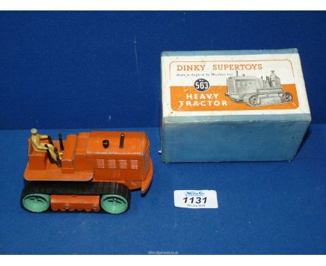A Dinky Supertoys No. 563 heavy tractor with orange body from 1948 - 1954.