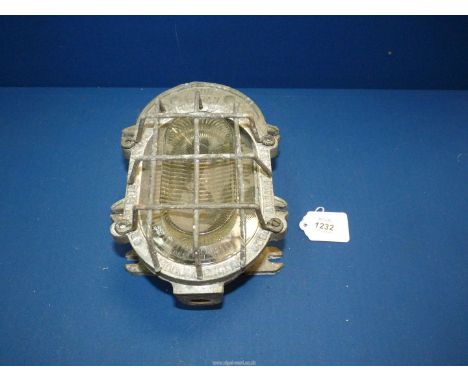 An unusual industrial caged Prismatic Glass bulkhead light fitting marked "The Wigan" by Heyes & Co, for restoration.