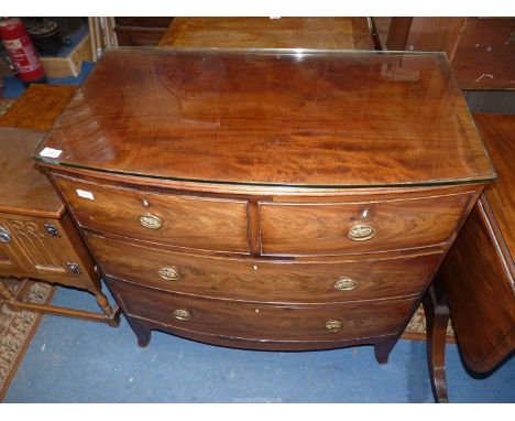 A bow fronted Mahogany Chest of two long and two short Drawers having brass/ormolu drop ring handles and standing on swept fr