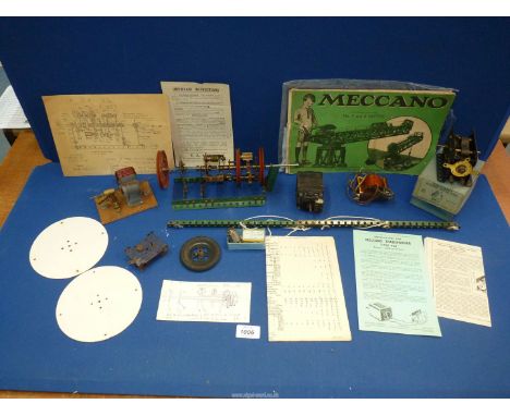 A Meccano Electric motor (E2OR 20 volt), a small transformer, a hand-made electrical motor and other Meccano pieces and manua