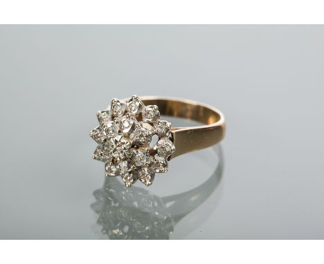 NINE CARAT GOLD DIAMOND CLUSTER RING
the bezel of floral form, pierced and set with a cluster of brilliant cut diamonds, hall