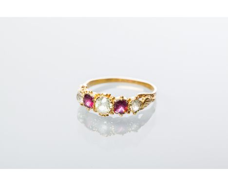 VICTORIAN RED AND YELLOW GEM SET RING
set with alternating rubies and diamonds, in srolling setting, unmarked, size L-M