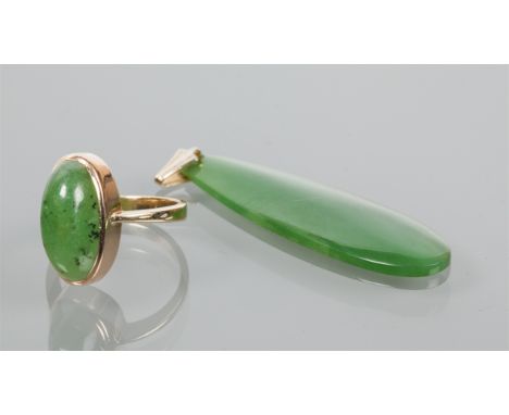 JADE PENDANT
set with a pear shaped section of darker green jade; along with a jade set ring (2)