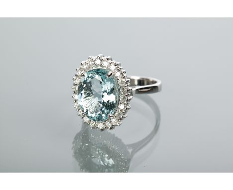 AQUAMARINE AND DIAMOND CLUSTER RING
set with a central oval aquamarine of 4.82 carats, surrounded by a row of brilliant cut d