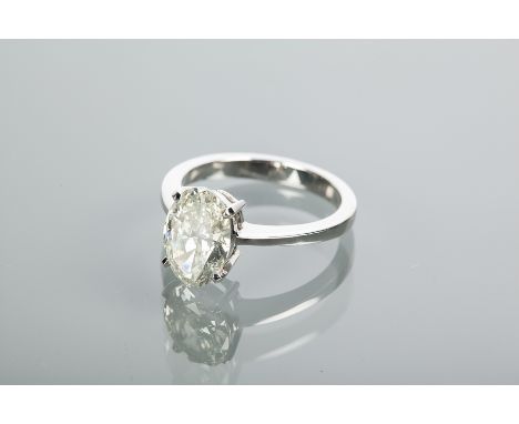 CERTIFICATED DIAMOND SOLITAIRE RING
the oval cut diamond measuring 2.15 carats, in eighteen carat white gold, size M, the cer