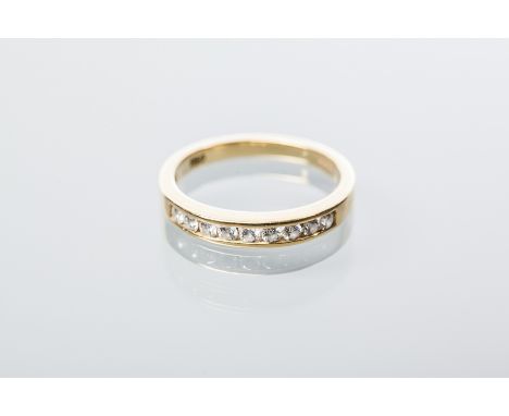 DIAMOND HALF ETERNITY RING
channel set with brilliant cut diamonds, in eighteen carat gold, size M