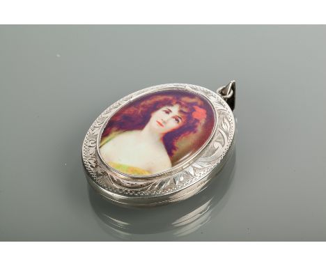 SILVER AND ENAMEL PORTRAIT LOCKET
of oval form, with a female portrait to the exterior, engraved decoration to border, hallma