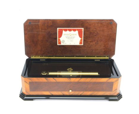 Reuge Sainte-Croix- 21st century Swiss musical box with a highly polished lacquered finish, inlaid and ebonised case with a g
